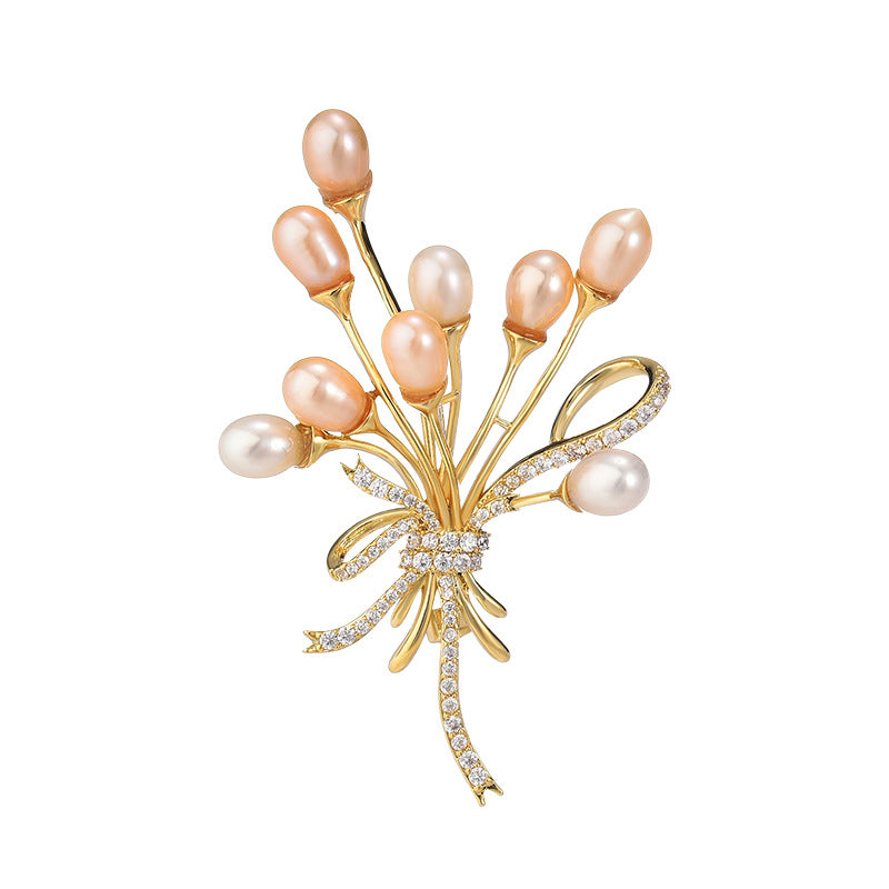 Broche ballon en perles naturelles